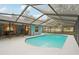 Inviting screened pool with ample deck space at 1662 Spottswood Cir, Palm Harbor, FL 34683