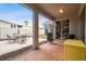 Relaxing screened patio with brick pavers, seating area, and grill at 1771 Wood Brook St, Tarpon Springs, FL 34689