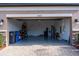 Clean garage interior featuring epoxy flooring and ample storage, plus storm door at 19427 Redwood Point Dr, Tampa, FL 33647