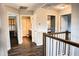 Hallway view showcasing multiple bedrooms and bathrooms, highlighting the home's layout and design at 19427 Redwood Point Dr, Tampa, FL 33647