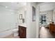 Clean bathroom with a shower/tub combo, toilet and dark brown vanity at 199 Dali Blvd # 407, St Petersburg, FL 33701