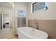 Spa-like bathroom with a freestanding soaking tub and elegant fixtures at 199 Dali Blvd # 407, St Petersburg, FL 33701