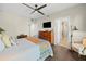 Spacious bedroom with a ceiling fan, dresser, and ensuite bathroom access at 199 Dali Blvd # 407, St Petersburg, FL 33701
