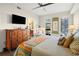 Spacious bedroom with a wooden dresser and comfy bedding at 199 Dali Blvd # 407, St Petersburg, FL 33701