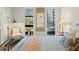 Bright bedroom with large windows, comfortable seating, and stylish decor at 199 Dali Blvd # 407, St Petersburg, FL 33701