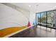 Modern building lobby with artistic wall mural and seating area at 199 Dali Blvd # 407, St Petersburg, FL 33701