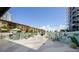 Tropical-themed courtyard with seating, murals, and modern sculptures at 199 Dali Blvd # 407, St Petersburg, FL 33701