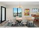 Elegant dining room with a live edge wood table and modern chandelier at 199 Dali Blvd # 407, St Petersburg, FL 33701