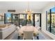Bright dining room with a live edge wood table and access to a patio at 199 Dali Blvd # 407, St Petersburg, FL 33701
