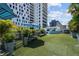 Artificial turf dog park with benches and a pet washing station at 199 Dali Blvd # 407, St Petersburg, FL 33701