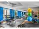 Fitness center with dumbbells, weight bench, exercise balls, and yoga mats at 199 Dali Blvd # 407, St Petersburg, FL 33701