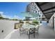 Outdoor dining area with grill and tables under umbrellas at 199 Dali Blvd # 407, St Petersburg, FL 33701