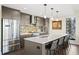 Modern kitchen with island, stainless steel appliances, and white quartz counters at 199 Dali Blvd # 407, St Petersburg, FL 33701