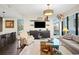 Stylish living room featuring comfortable seating, a large TV, and city views at 199 Dali Blvd # 407, St Petersburg, FL 33701