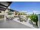 Outdoor patio with tables, chairs, and a built-in grill at 199 Dali Blvd # 407, St Petersburg, FL 33701