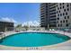 Round swimming pool with surrounding lounge chairs at 199 Dali Blvd # 407, St Petersburg, FL 33701