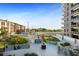 Resort-style pool area with lush landscaping and a play area at 199 Dali Blvd # 407, St Petersburg, FL 33701