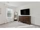 Bright bedroom with large window, dresser, and mirror at 21428 Darter Rd, Land O Lakes, FL 34638