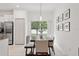 Bright dining area with wooden table and view of backyard at 21428 Darter Rd, Land O Lakes, FL 34638
