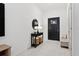 Bright entryway with tile floors and a stylish console table at 21428 Darter Rd, Land O Lakes, FL 34638