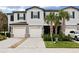 Two-story townhome with attached garage and landscaping at 21428 Darter Rd, Land O Lakes, FL 34638