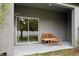 Covered patio with seating area and sliding glass doors at 21428 Darter Rd, Land O Lakes, FL 34638