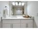 Bathroom vanity with white shaker cabinets and quartz countertop at 220 Belleview Blvd # 101, Belleair, FL 33756