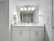 Bathroom with double vanity and modern finishes at 220 Belleview Blvd # 101, Belleair, FL 33756