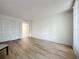 Spacious bedroom with light wood flooring and ample closet space at 220 Belleview Blvd # 101, Belleair, FL 33756
