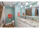 Bathroom with granite countertop and stone wall accents at 2621 Cove Cay Dr # 205, Clearwater, FL 33760