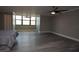 Spacious bedroom with ceiling fan, light gray walls, durable flooring and bright window at 2621 Cove Cay Dr # 205, Clearwater, FL 33760
