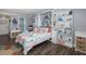 Guest bedroom with full-size bed and ocean decor at 2621 Cove Cay Dr # 205, Clearwater, FL 33760