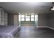 Spacious bedroom with ceiling fan, light gray walls, durable flooring and bright window at 2621 Cove Cay Dr # 205, Clearwater, FL 33760