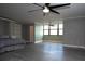 Spacious bedroom with ceiling fan, light gray walls, durable flooring and bright window at 2621 Cove Cay Dr # 205, Clearwater, FL 33760
