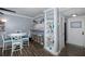 Bright dining area with a table, chairs, and built-in shelving at 2621 Cove Cay Dr # 205, Clearwater, FL 33760