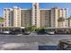 Condominium building with covered parking and a beautifully landscaped area at 2621 Cove Cay Dr # 205, Clearwater, FL 33760