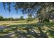 Golf course view with pond and lush landscaping at 2621 Cove Cay Dr # 205, Clearwater, FL 33760