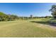 Peaceful golf course view with a building in the background at 2621 Cove Cay Dr # 205, Clearwater, FL 33760