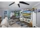 Bright living room featuring comfortable seating and large screen TV at 2621 Cove Cay Dr # 205, Clearwater, FL 33760