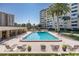 Refreshing community pool with plenty of lounge chairs at 2621 Cove Cay Dr # 205, Clearwater, FL 33760