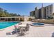 Enjoy the resort-style pool and hot tub with patio furniture at 2621 Cove Cay Dr # 205, Clearwater, FL 33760