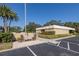 Community pool area with a seating area and parking at 2621 Cove Cay Dr # 205, Clearwater, FL 33760