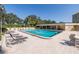 Inviting pool area with lounge chairs and a hot tub at 2621 Cove Cay Dr # 205, Clearwater, FL 33760