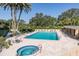 Relaxing pool and hot tub area with patio furniture at 2621 Cove Cay Dr # 205, Clearwater, FL 33760