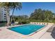 Refreshing community pool with plenty of lounge chairs at 2621 Cove Cay Dr # 205, Clearwater, FL 33760