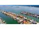 Wide shot of waterfront community with many homes and canals at 301 Midway Is, Clearwater Beach, FL 33767