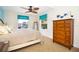 Bright bedroom with ceiling fan and large windows at 301 Midway Is, Clearwater Beach, FL 33767