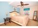 Coastal-themed bedroom with ceiling fan and dresser at 301 Midway Is, Clearwater Beach, FL 33767