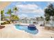 Enjoy this waterfront pool and spa with seating area at 301 Midway Is, Clearwater Beach, FL 33767
