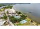 Aerial view of beach with pier, parking, tennis courts and playground close to ocean at 3027 Bermuda Sloop Cir, Ruskin, FL 33570